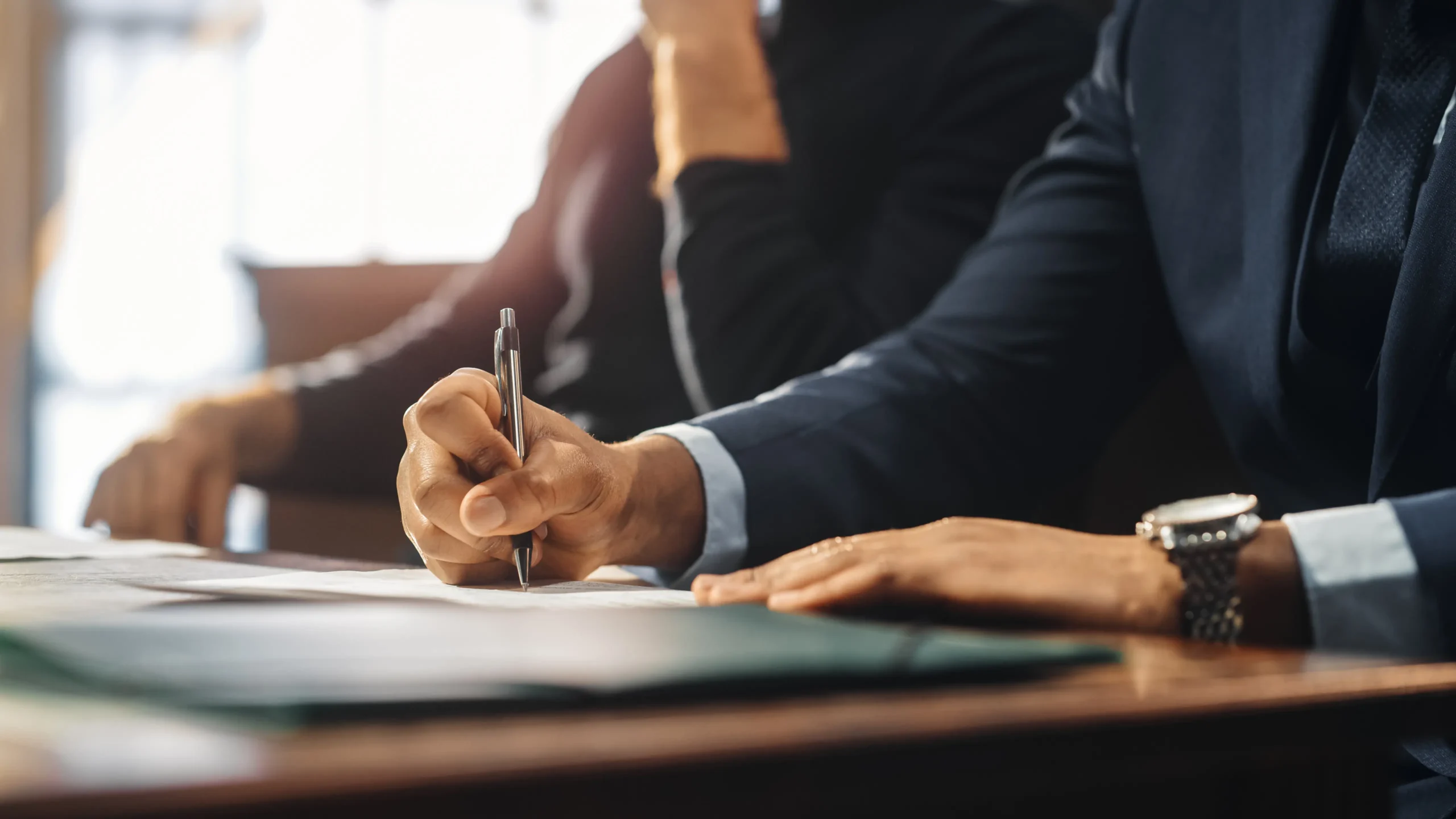Car accident attorney signing legal documents for a compensation case in Placer County